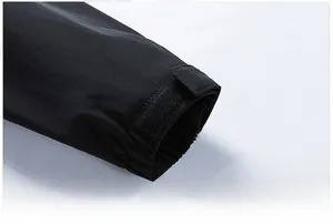 Close-up of adjustable velcro cuffs on black windproof business casual jacket