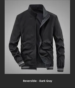 Detail view of the reversible dark gray jacket showing striped cuffs and zipper hardware