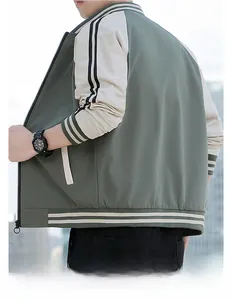Back view of a casual baseball jacket in sage green and beige with striped ribbed cuffs