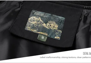 Close-up of the jacket collar with embroidered mountain logo and size M tag