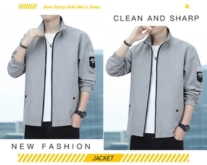 Detail of light gray casual jacket sleeve featuring a SPORT OUTDOOR patch and ribbed cuff
