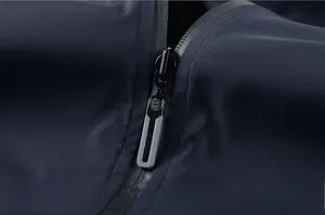 Detailed close-up of high-quality waterproof zipper on navy blue casual jacket