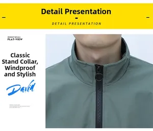Detail of dark green standing collar jacket with round metal zipper puller and windproof fabric