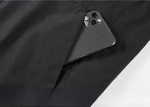 Detail of reversible jacket side pocket showing depth and high-quality tech fabric