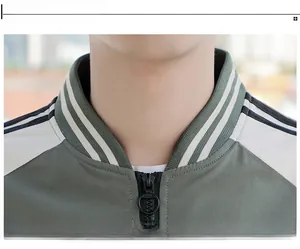 Close-up of olive green and white ribbed baseball collar with premium zipper detail