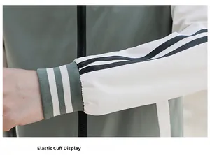 Detail of elastic ribbed cuffs with reflective elements on a hooded baseball jacket