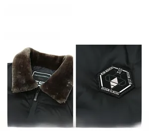Close-up of winter jacket with brown faux fur collar and embroidered hexagon badge