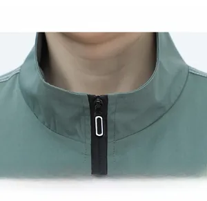 Detail of windproof stand-up collar and premium black zipper on bean green work jacket
