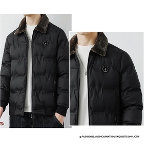 Detail of men's black winter jacket featuring a plush brown faux fur collar and logo patch