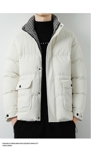 Detail view of men's white puffer jacket featuring houndstooth collar and flap pockets
