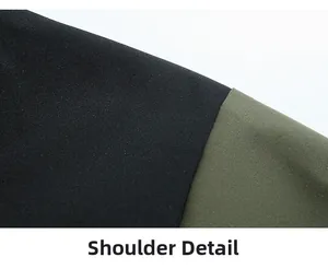 Shoulder detail of a windbreaker jacket featuring black and olive green colorblock design