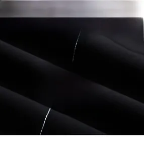 Macro de la texture du tissu 100% polyester de haute qualité pour veste homme