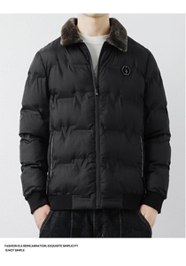 Detail of men's winter jacket with brown faux fur collar and black hexagon logo badge