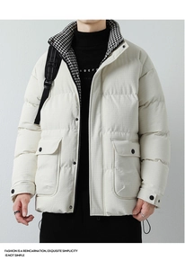 Detail of men's padded jacket showing classic houndstooth lining and stand collar
