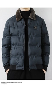 Detail of navy quilted jacket featuring a brown faux fur collar and hexagon chest badge