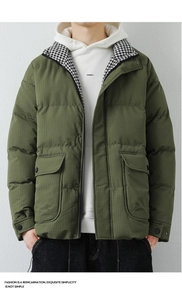 Detail of olive green puffer jacket featuring houndstooth lining and large flap pockets