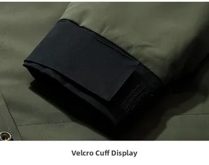 Close-up of adjustable Velcro cuffs on a military green windproof outdoor jacket