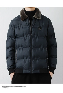 Detailed close-up of men's quilted jacket with a brown faux fur collar and ribbed cuffs