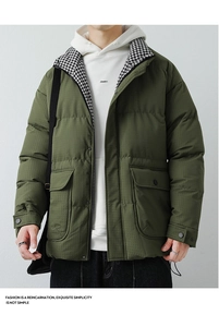 Detail of green men's utility puffer jacket with houndstooth lining and large flap pockets