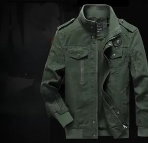 Detail of dark green cotton utility jacket showing shoulder epaulettes and functional pockets