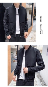 Détail de la veste décontractée noire avec surpiqûres contrastées et bords-côtes
