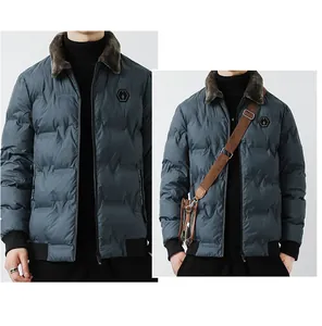 Detail of blue-gray padded winter coat with faux fur collar and hexagonal chest emblem