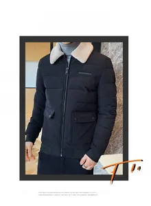 Detail of men's winter jacket showing quilted texture and white faux shearling collar