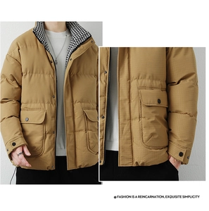 Detail view of khaki winter puffer jacket featuring micro-grid texture and large pockets