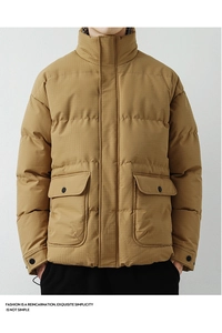 Detail of men's yellow padded jacket showing ripstop texture and large flap pockets