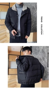 Close-up of winter jacket featuring gray faux shearling collar and slogan print on pocket