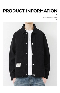 Detail of black corduroy jacket with contrast metal buttons and woven pocket label