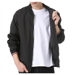 Detail view of the striped ribbed cuffs and high-quality metal zipper on a men's bomber jacket