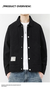 Detailed close-up of a black corduroy jacket showing silver metal buttons and woven label