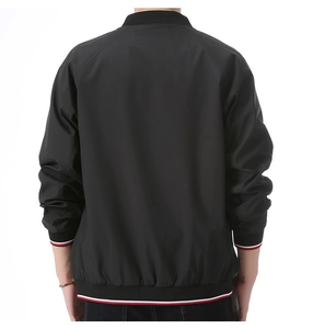 Back view of a black bomber jacket with red and white striped ribbed cuffs and hemline