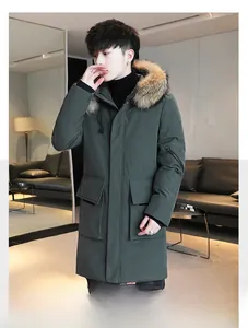 Detail of dark green men's padded parka with large faux fur collar and functional pockets