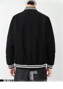 Back view of black corduroy bomber jacket featuring white striped ribbed cuffs and hem