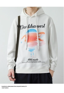 Gros plan du graphique de coucher de soleil et texte imprimé sur un sweat blanc en coton