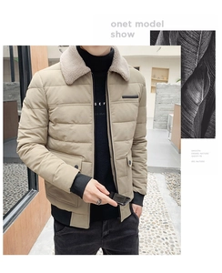 Detail of khaki men's winter jacket featuring a plush lamb wool collar and zip closure