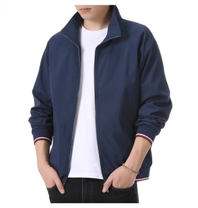 Detail of navy blue men's bomber jacket showing striped ribbed cuffs and zipper
