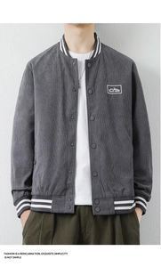 Detail of grey corduroy baseball jacket with striped ribbed collar and mountain logo patch