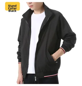 Close-up of black baseball collar jacket with red and white striped cuffs and hem details