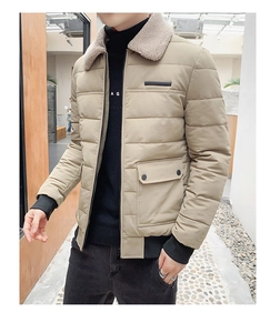 Detail of khaki quilted winter jacket showing the beige lamb wool collar and cargo pocket
