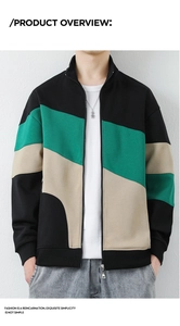 Detailed view of color-block patchwork stitching on a men's zip-up stand collar sweatshirt