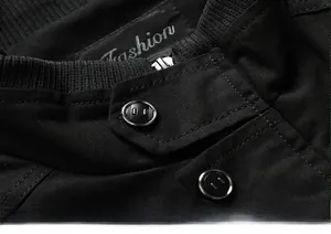 Close-up of cotton jacket ribbed stand collar with metal zipper and button details