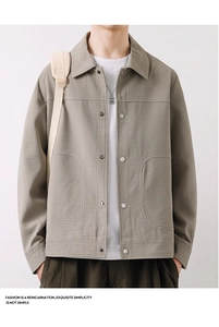 Close-up of khaki waffle texture jacket with lapel collar and stylish metallic buttons