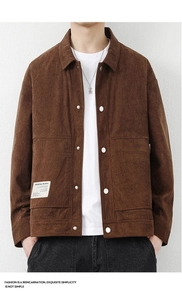Detail of men's brown corduroy jacket showing texture, buttons and woven label