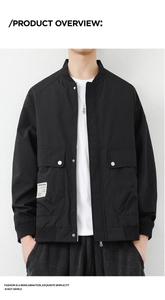 Detail of black utility jacket featuring flap pockets and brand label on front