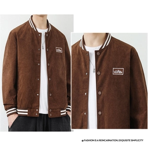 Detail of a brown corduroy baseball jacket with striped ribbed collar and mountain patch