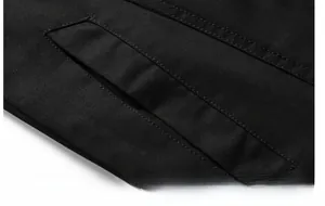 Detail of reinforced double stitching on durable black cotton workwear jacket pocket
