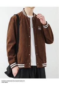 Detail of corduroy baseball jacket featuring striped ribbed collar and mountain patch